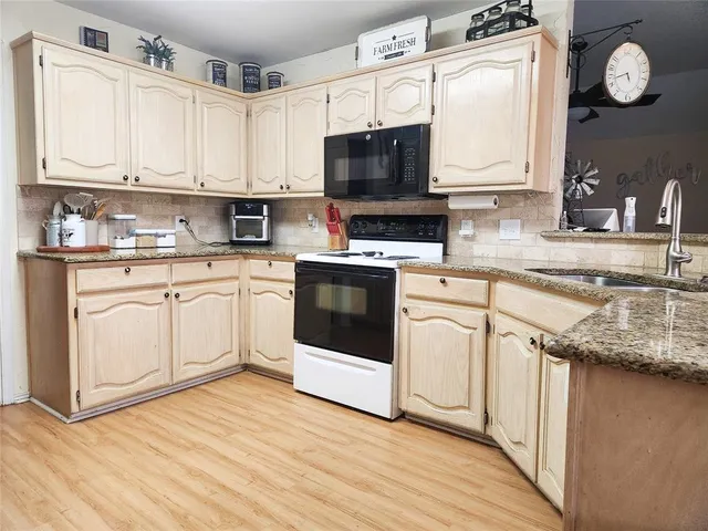 a kitchen with a cabinets and a stove