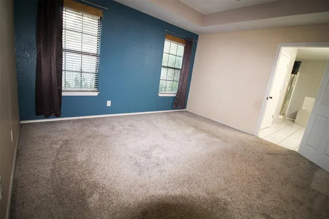 an empty room with windows