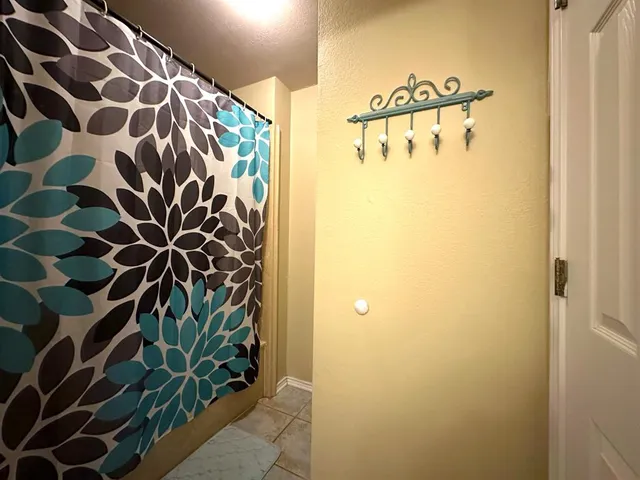 a kitchen that has a sink and a wooden floor