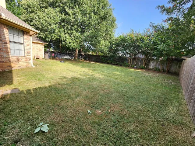 a view of a backyard with a slide