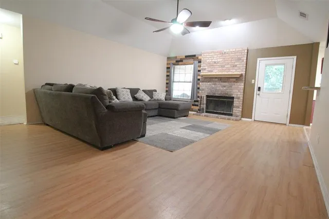 a living room with furniture window and a fireplace