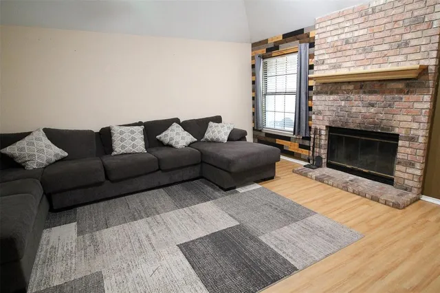 a living room with a couch and a chandelier