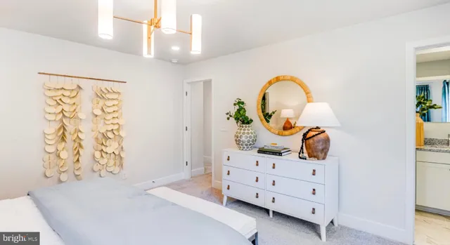 a bed room with a bed and a dresser