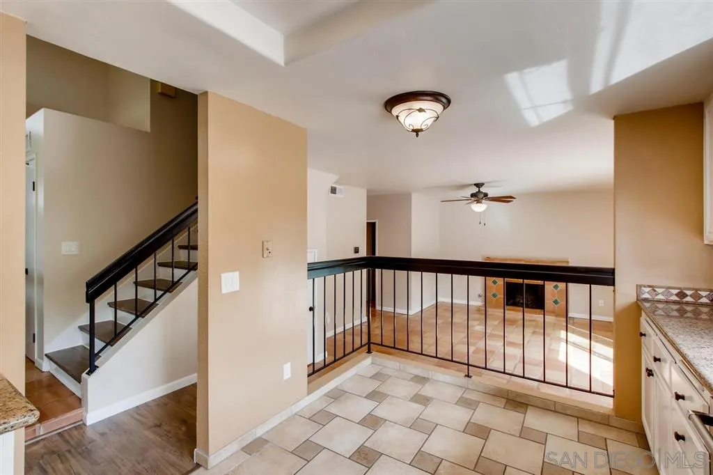 10411 Cadwell Road Santee, CA 92071 - Photo 12 of 25 a view of staircase with lots of frames on wall and a large window