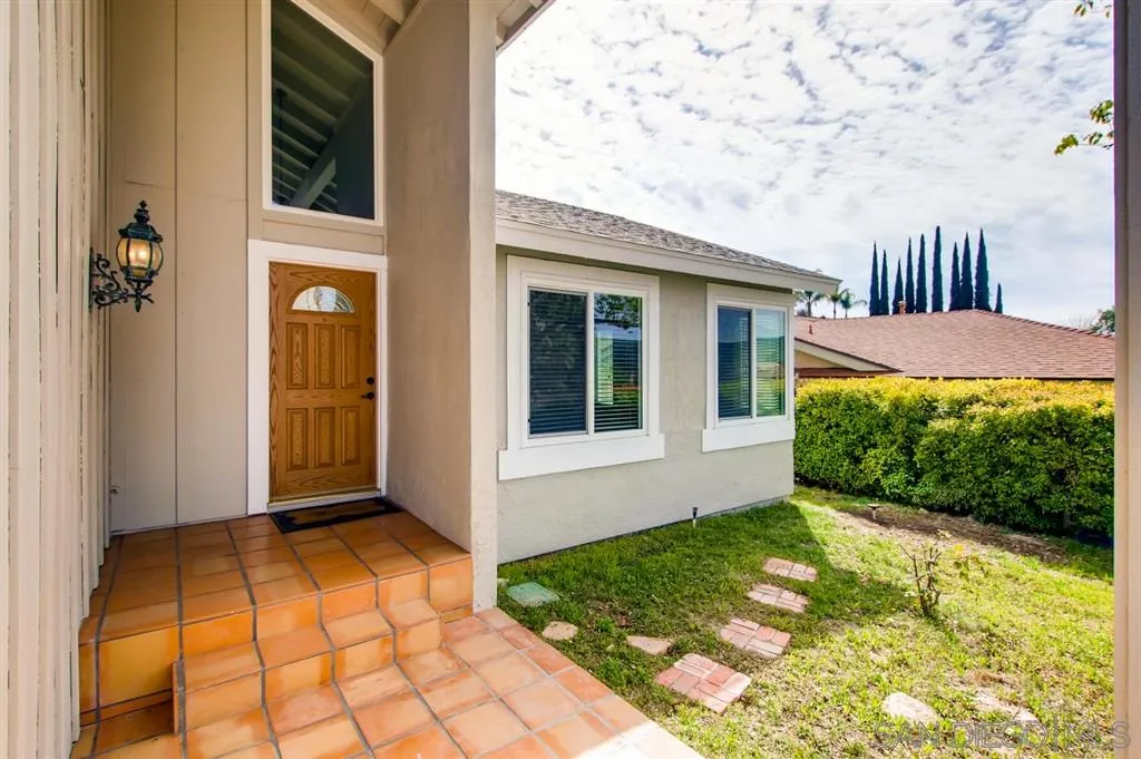 10411 Cadwell Road Santee, CA 92071 - Photo 3 of 25 a front view of a house with garden