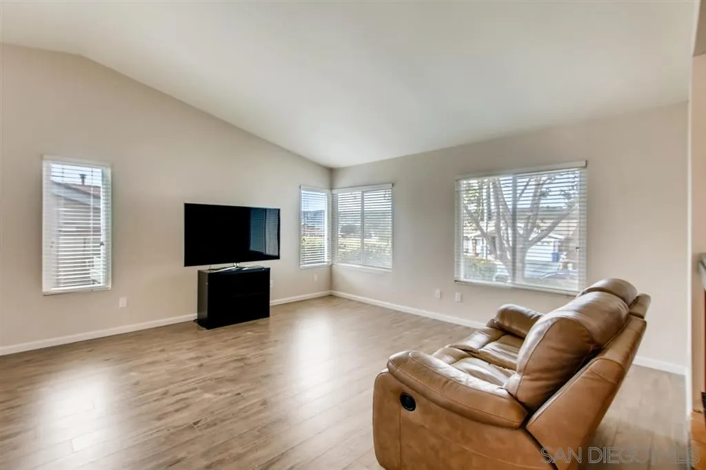 10411 Cadwell Road Santee, CA 92071 - Photo 6 of 25 a living room with furniture a flat screen tv and a large window