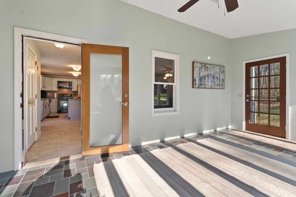 30 Butterworth Road Holland, MA 01521 - Photo 28 of 39 a bedroom with a bed and a large mirror