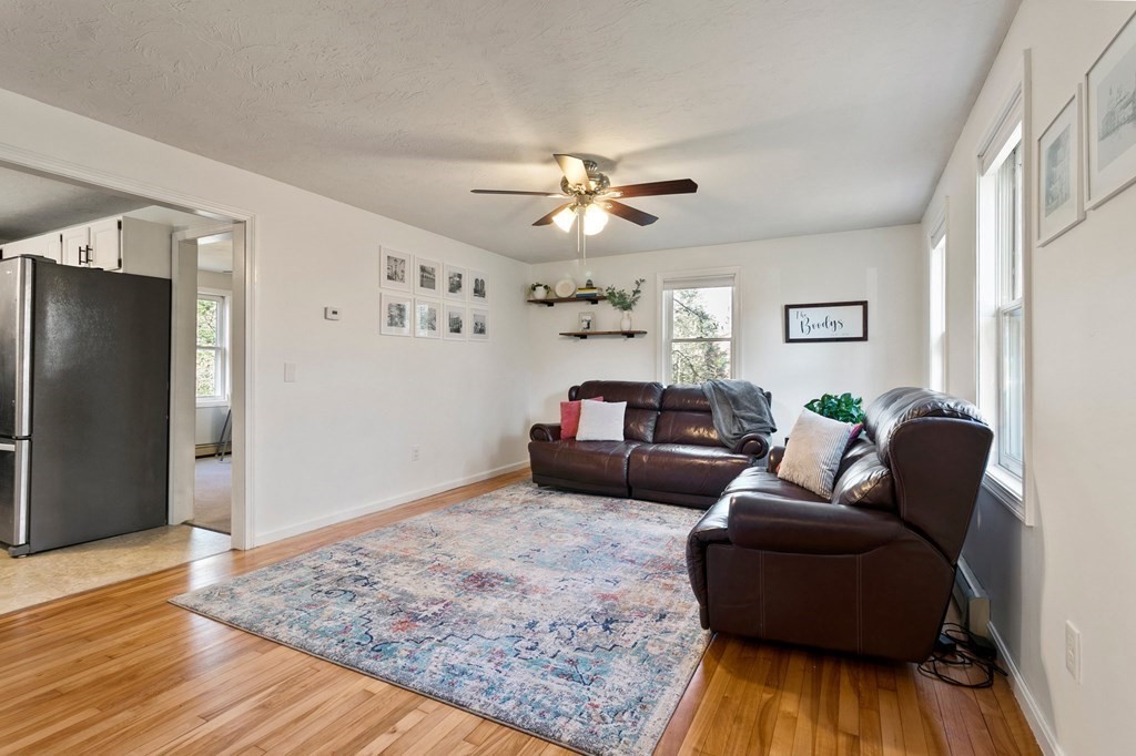 30 Butterworth Road Holland, MA 01521 - Photo 6 of 39 a living room with furniture and a wooden floor