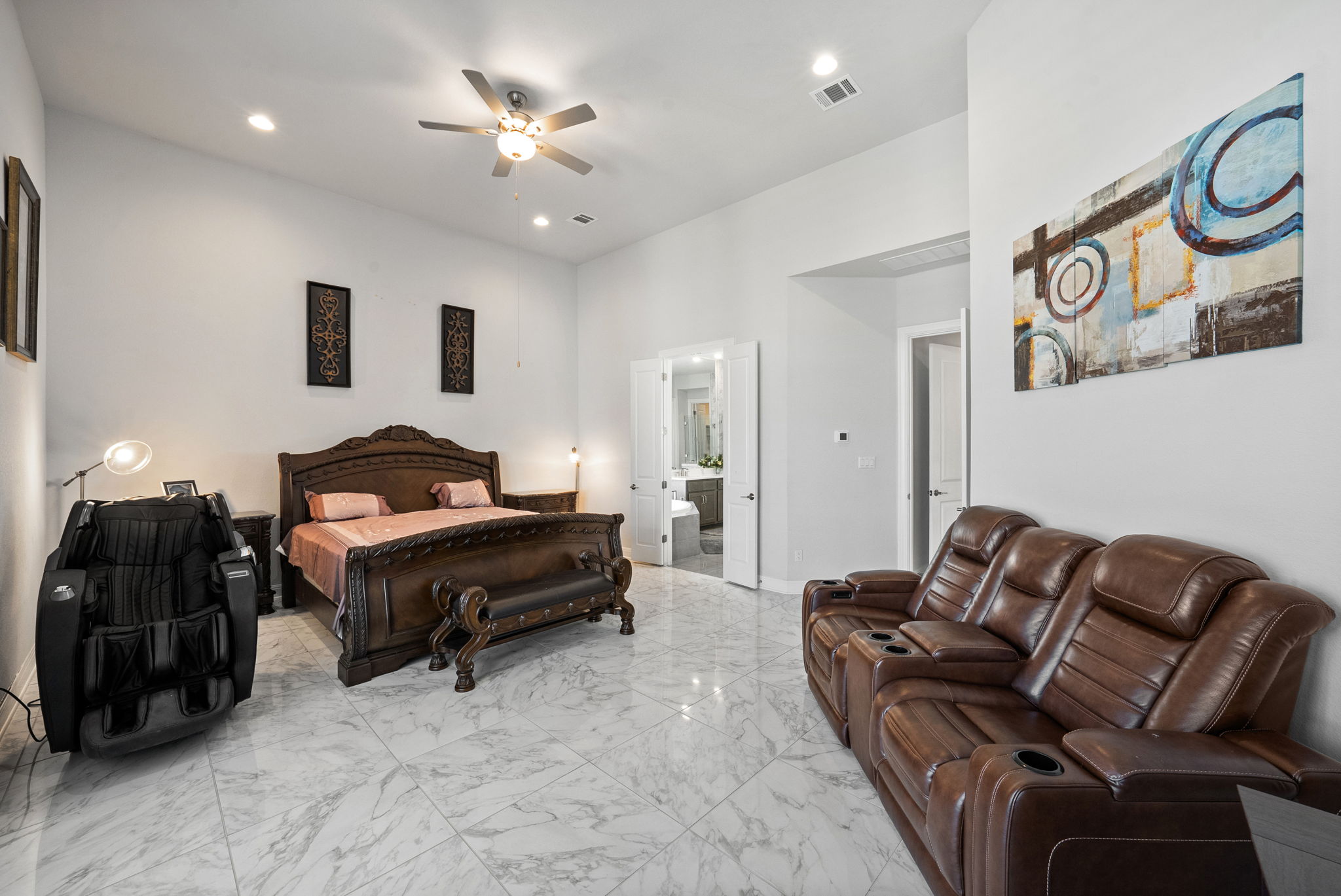 2132 Novara Trail Leander, TX 78641 - Photo 32 of 40 Bedroom featuring light marble finish flooring, recessed lighting, and ceiling fan
