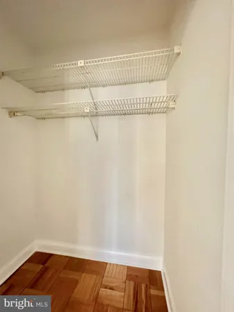 a view of a room with racks on the wall