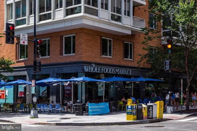a view of a food market with retail shops