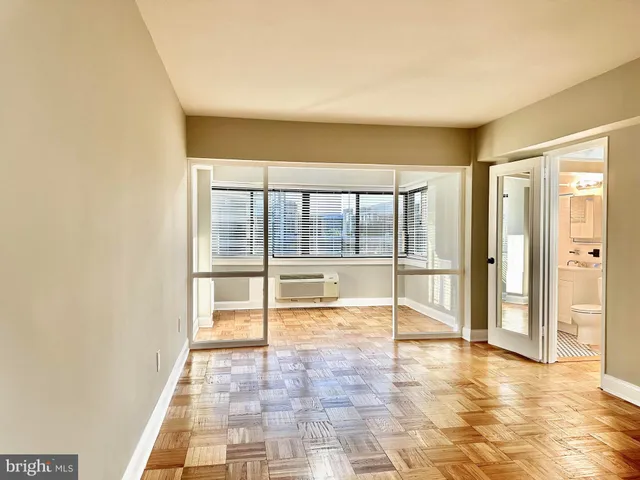 wooden floor with windows in an empty room