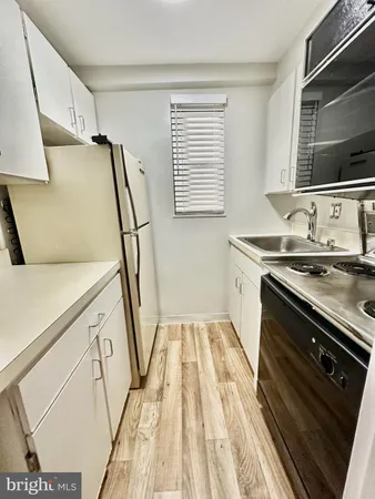 a bathroom with a sink a mirror and a bathtub