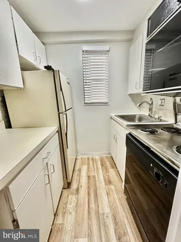 a bathroom with a sink a mirror and a bathtub