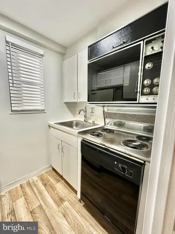 a kitchen with a stove and a microwave