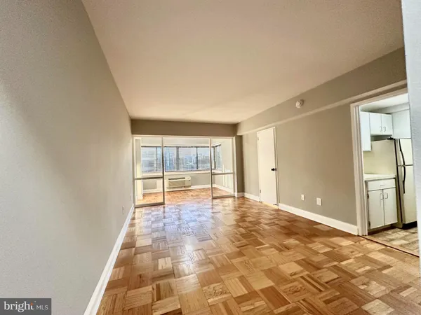 a view of an empty room with a window