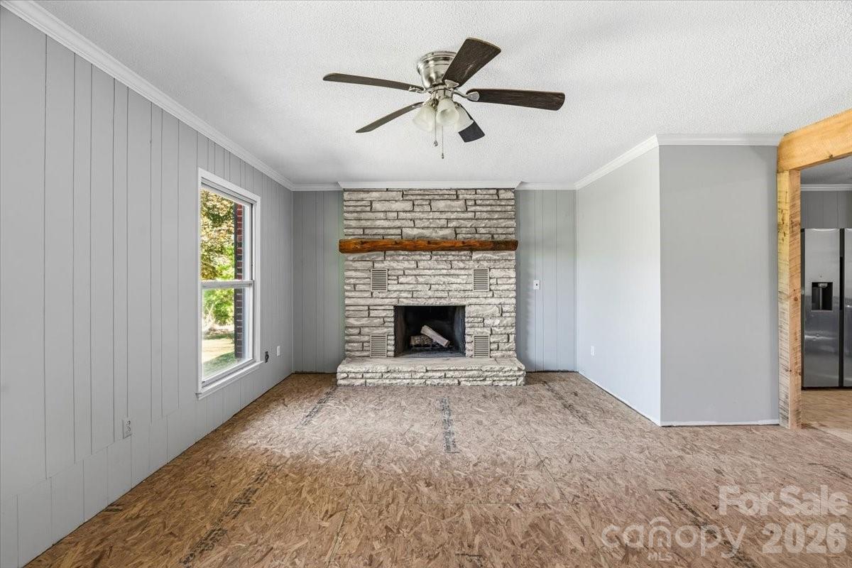 14 Jack Sullins Road Spruce Pine, NC 28777 - Photo 8 of 37 a view of an empty room with a fireplace and a window
