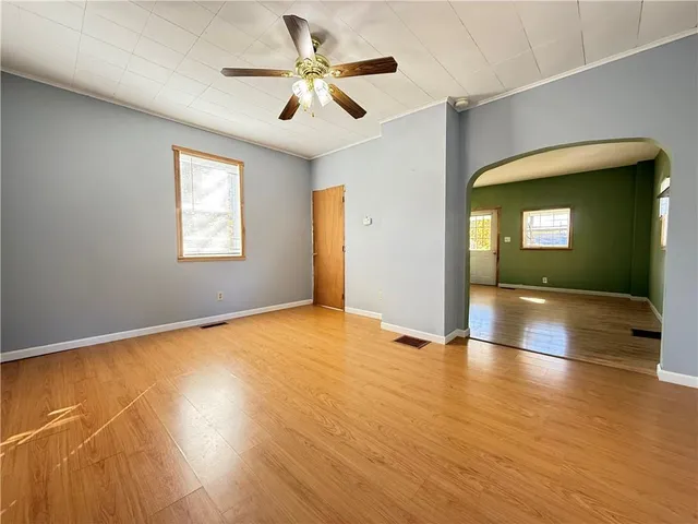 a view of an empty room with a window