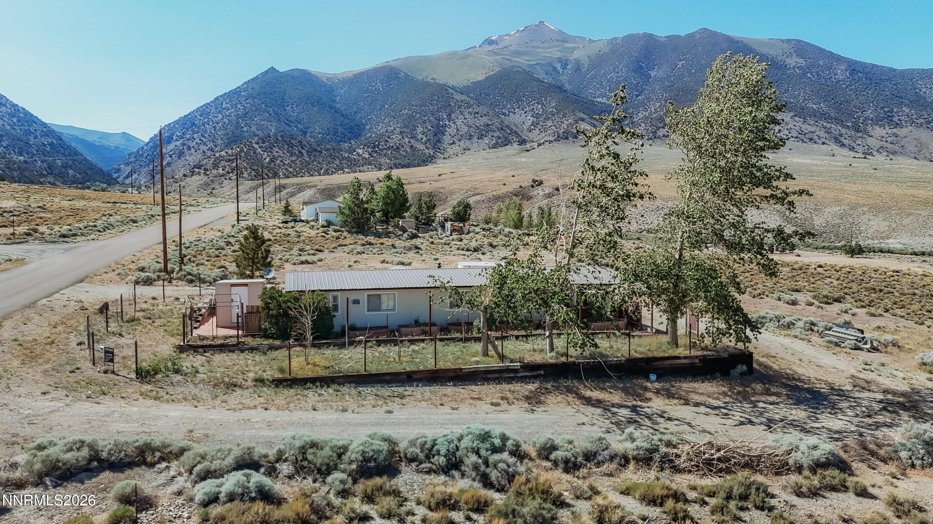8 Buckhorn Court Kingston, NV 89310 - Photo 1 of 34 a view of a house with a mountain and a forest