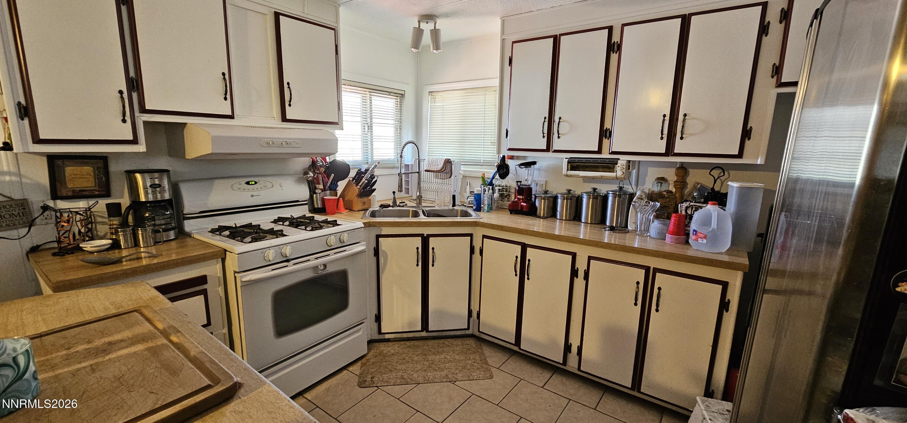 8 Buckhorn Court Kingston, NV 89310 - Photo 19 of 34 a kitchen with white cabinets and white appliances