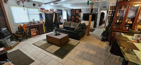 a living room with lots of furniture and gym equipment