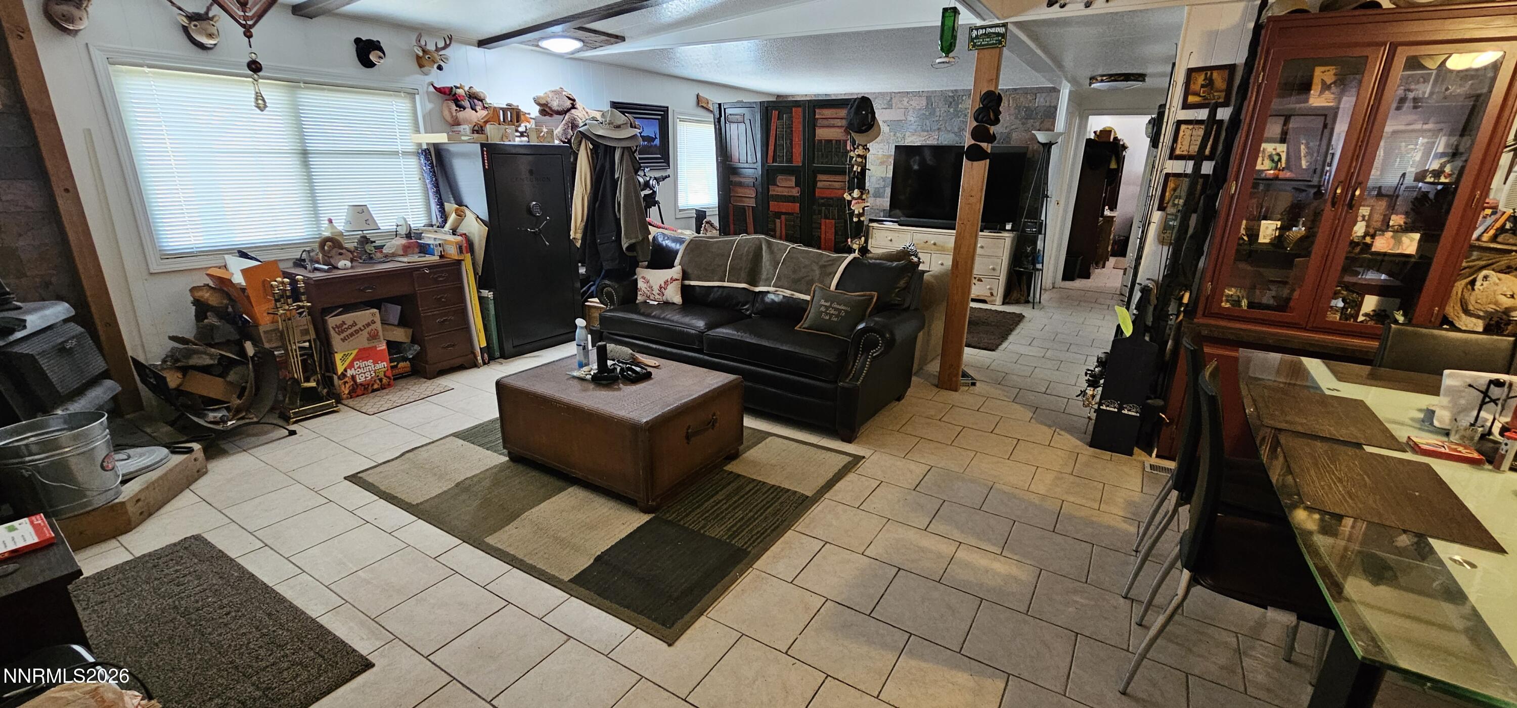 8 Buckhorn Court Kingston, NV 89310 - Photo 23 of 34 a living room with lots of furniture and gym equipment