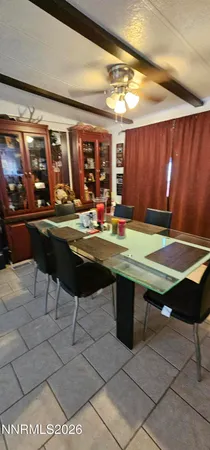 a room with pool table and windows