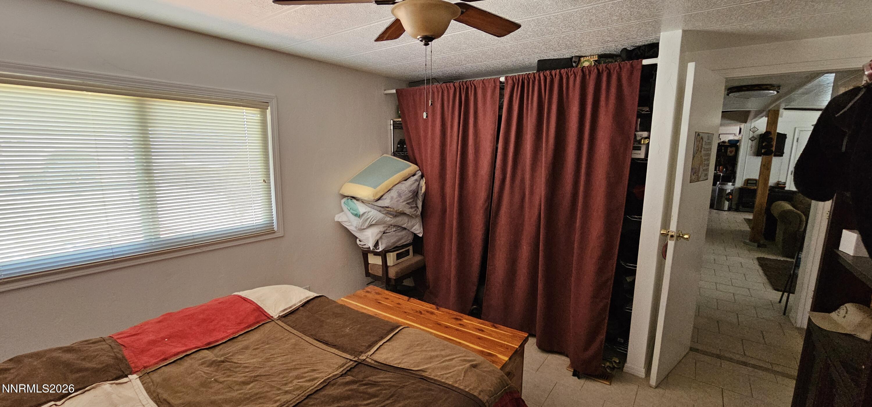 8 Buckhorn Court Kingston, NV 89310 - Photo 34 of 34 a bedroom with a bed and a chandelier