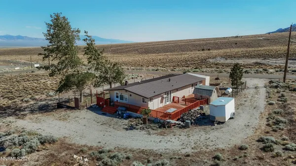 an aerial view of a house with beach and ocean view