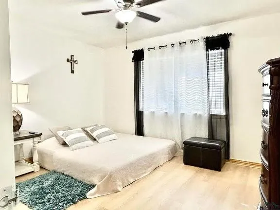 a bedroom with a bed and a mirror