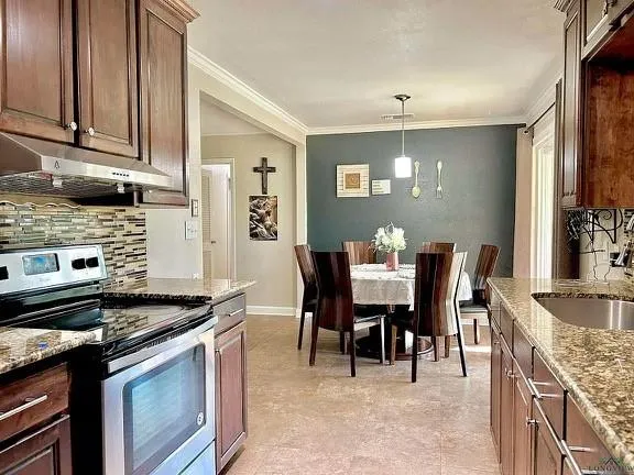 a kitchen with a stove and cabinets