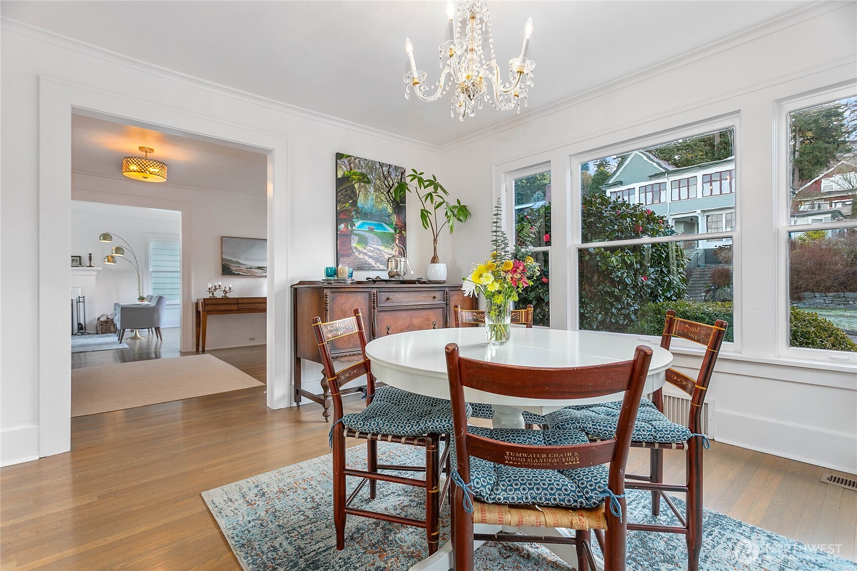 322 South Forest Street Bellingham, WA 98225 - Photo 11 of 34 a dining room with furniture a rug a potted plant and a chandelier