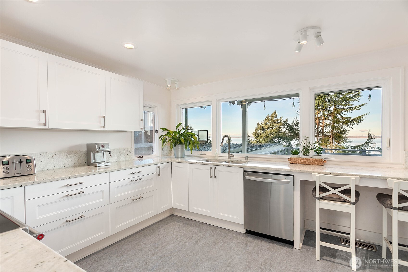 322 South Forest Street Bellingham, WA 98225 - Photo 13 of 34 a kitchen with white cabinets and white appliances
