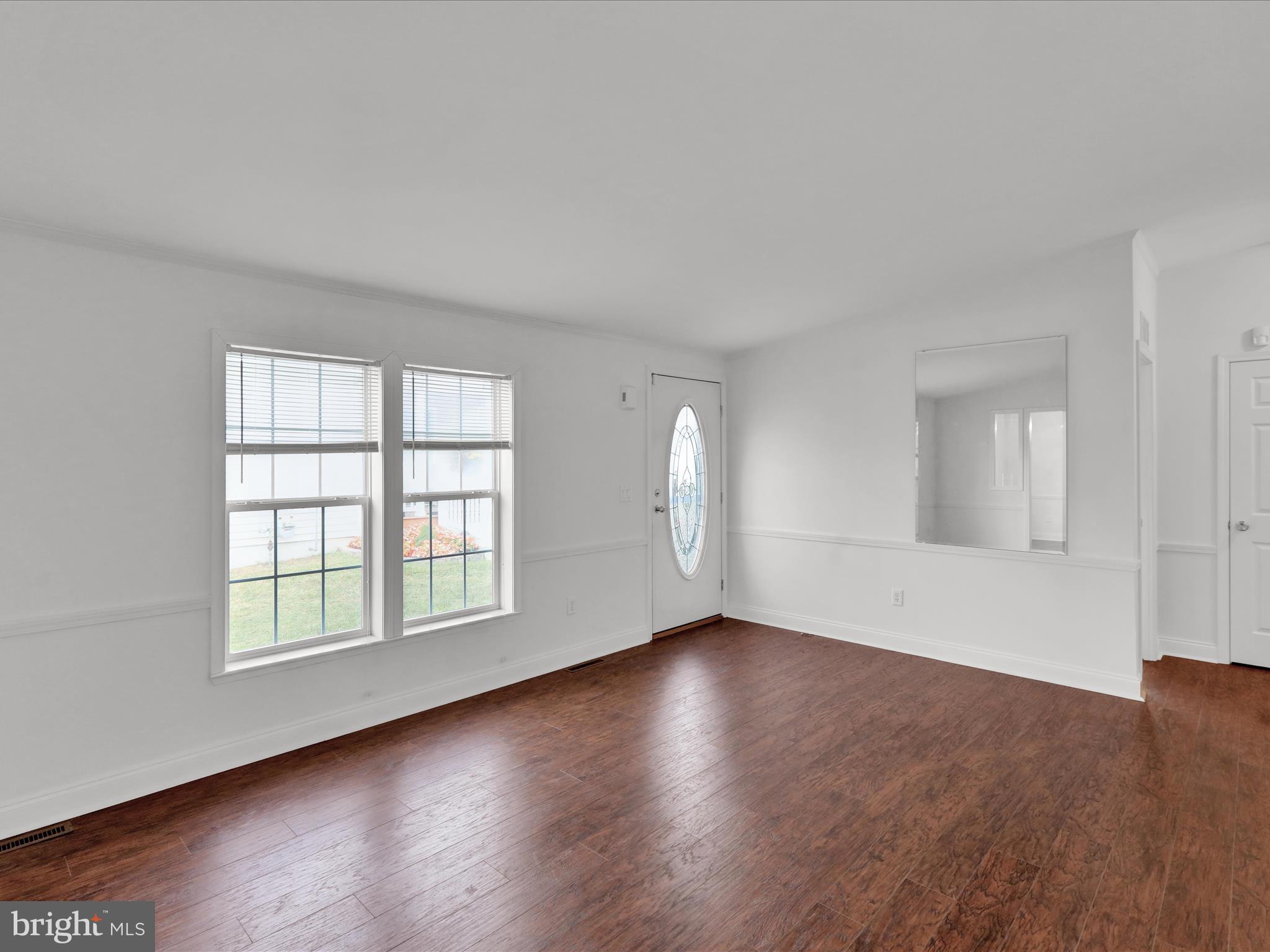 25 Random Road Douglassville, PA 19518 - Photo 12 of 41 an empty room with wooden floor and windows