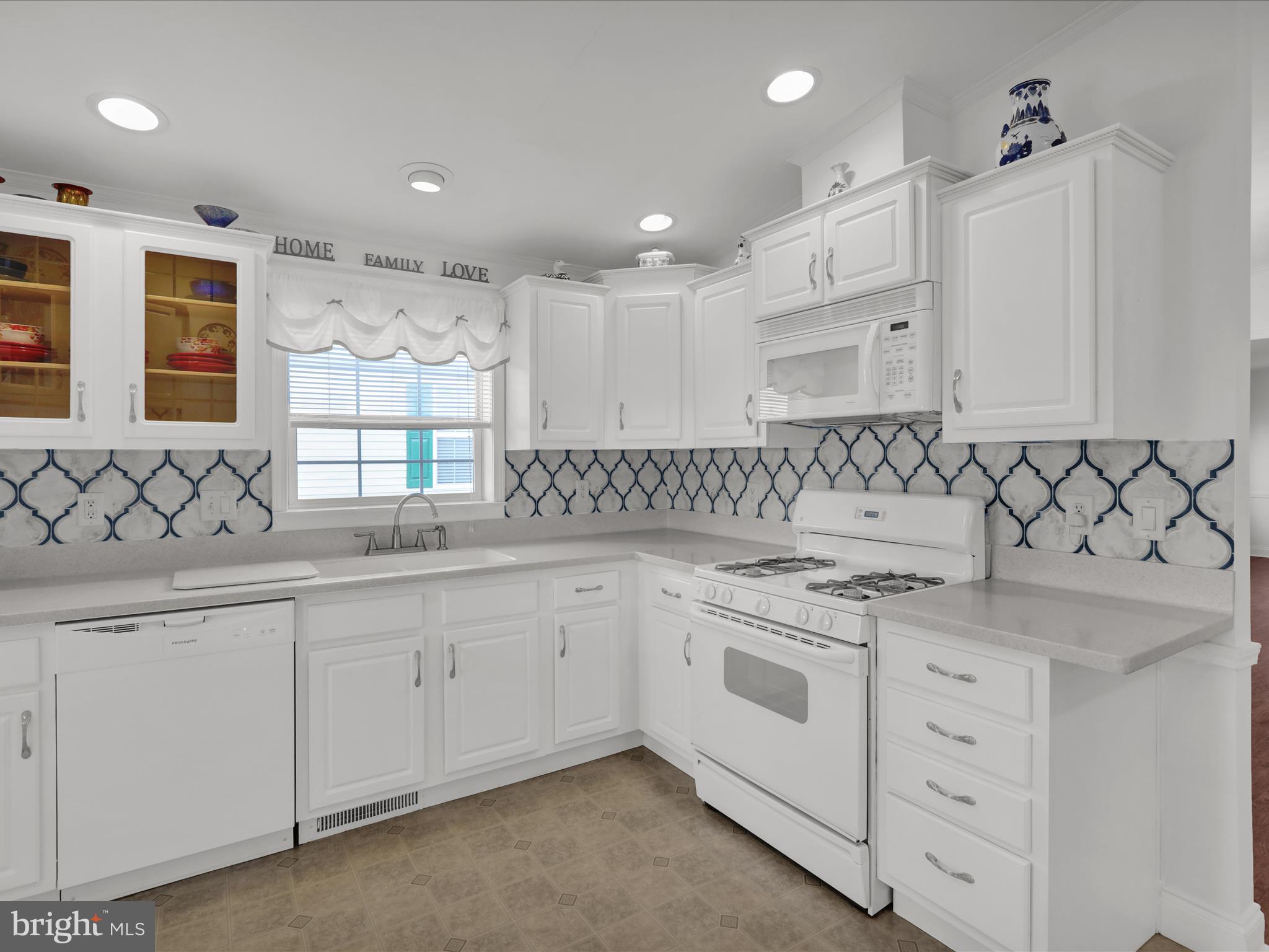 25 Random Road Douglassville, PA 19518 - Photo 17 of 41 a kitchen with granite countertop white cabinets and white appliances