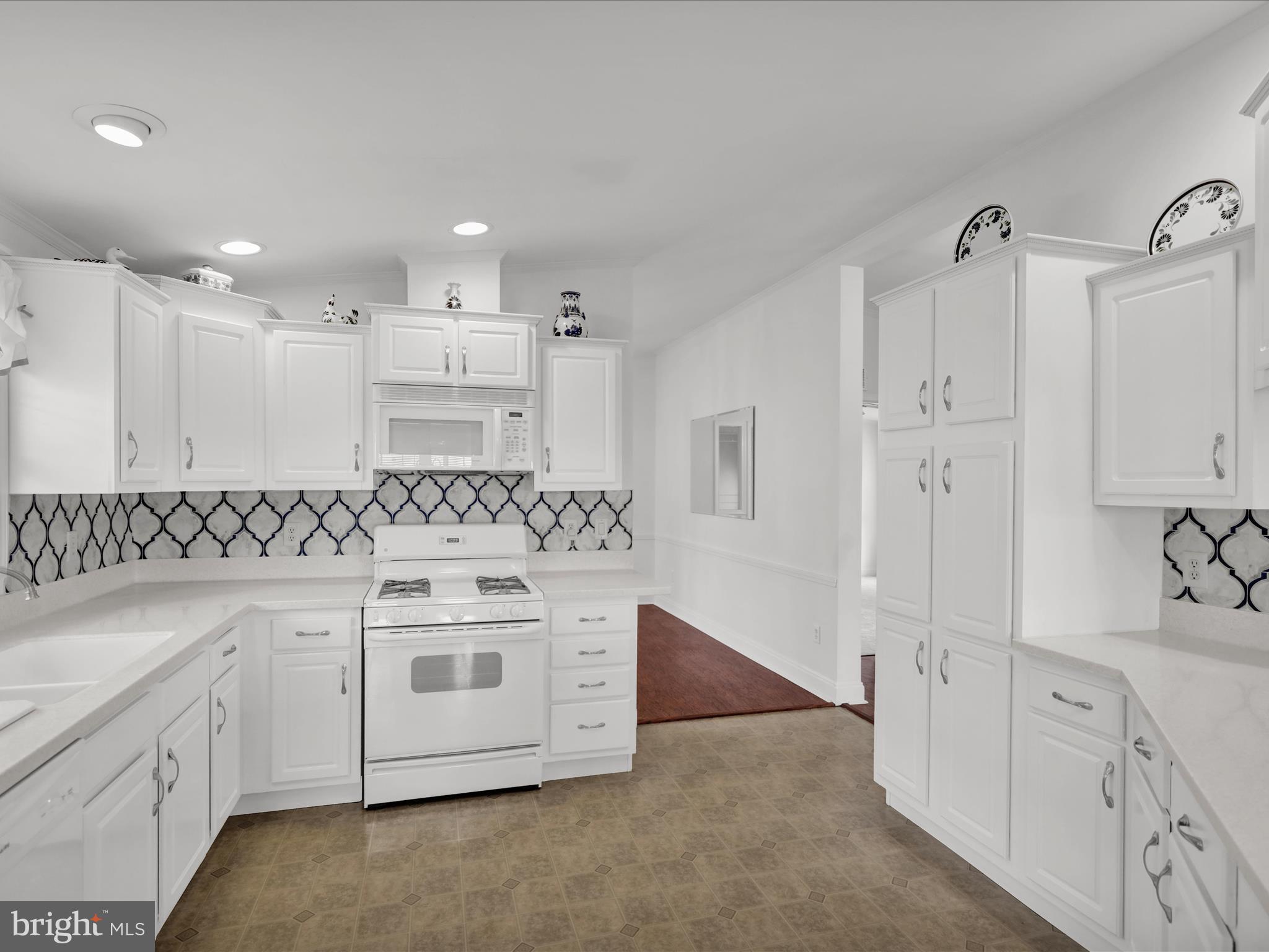 25 Random Road Douglassville, PA 19518 - Photo 20 of 41 a kitchen with white cabinets and sink