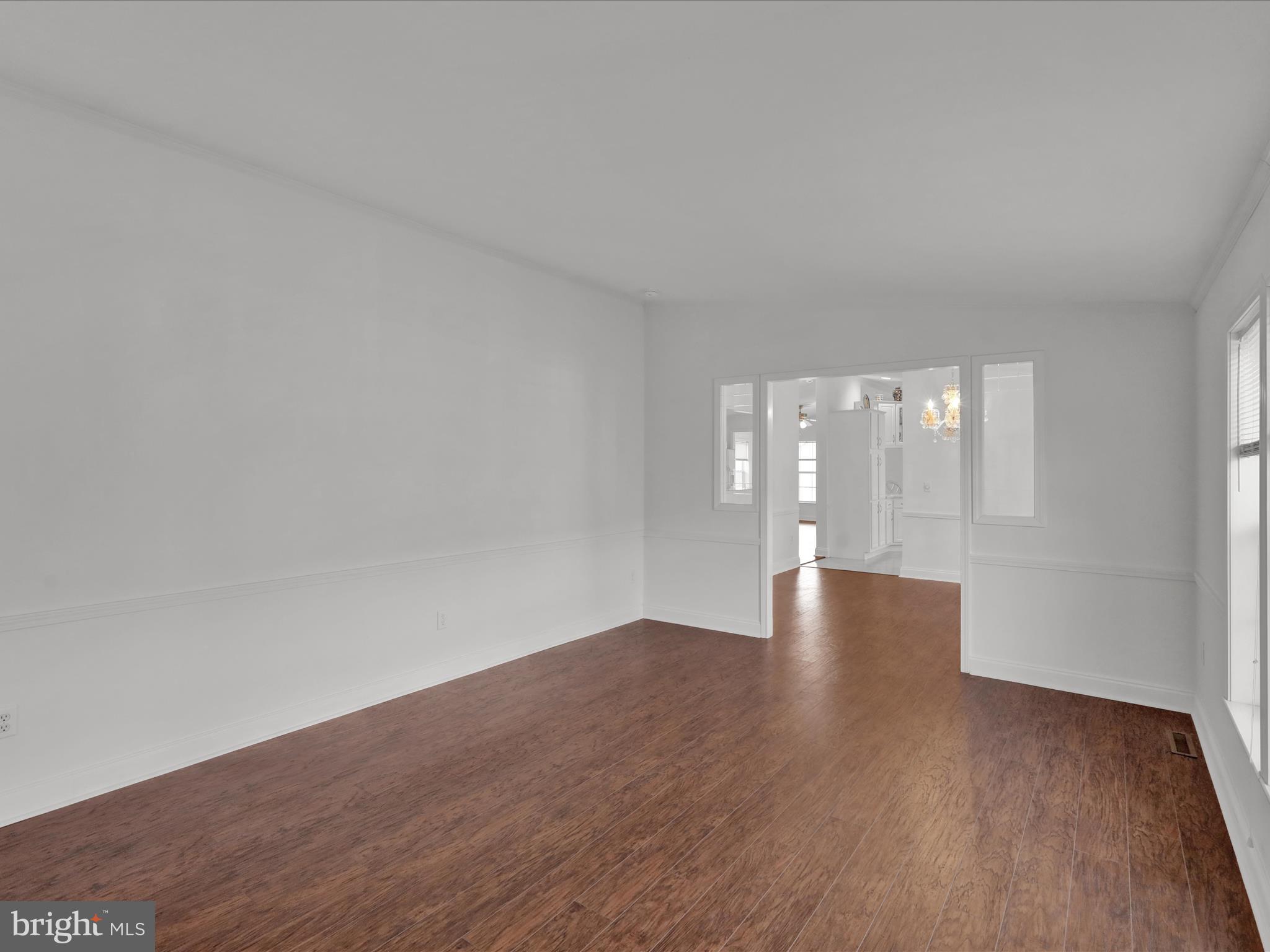 25 Random Road Douglassville, PA 19518 - Photo 10 of 41 a view of an empty room with wooden floor and a window