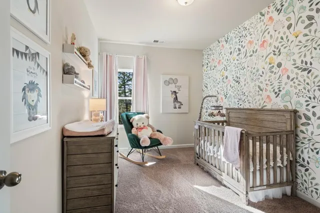 a view of a hallway with closet and wooden floor
