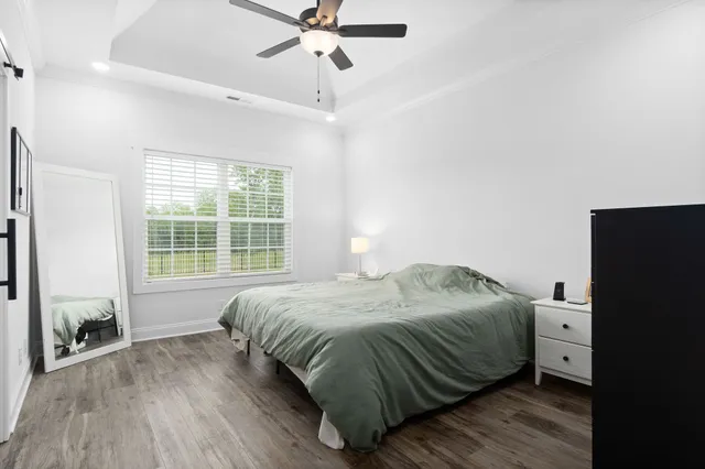 a bedroom with a bed and window