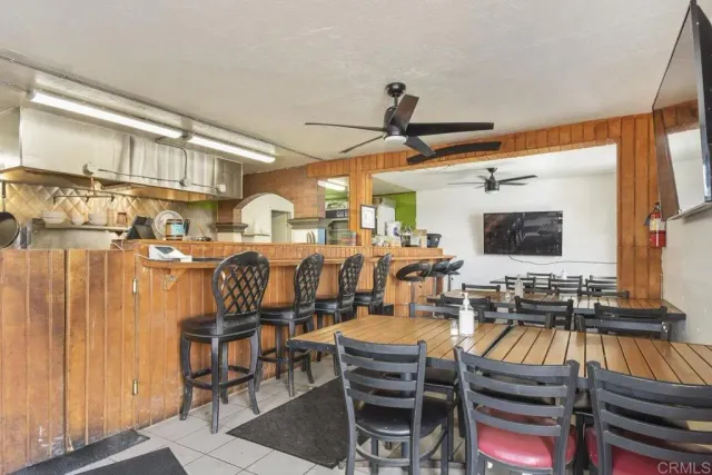 a living room with lots of furniture and a flat screen tv