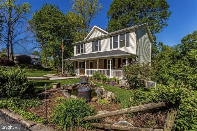 505 4th Avenue Brunswick, MD 21716 - Photo 3 of 54 Charming home with lush greenery.