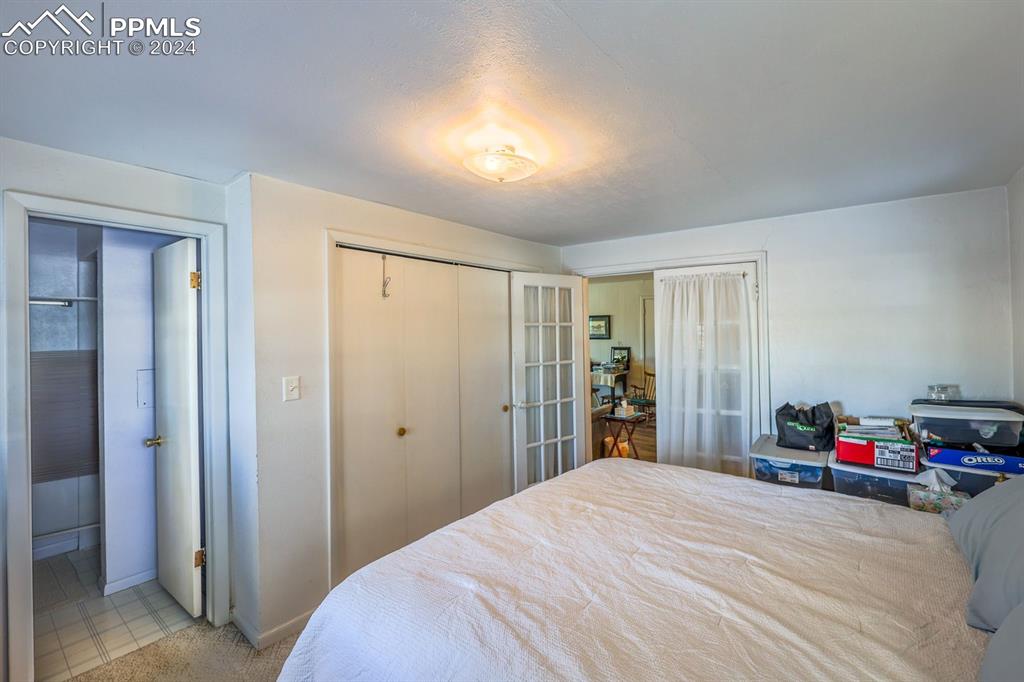 6597 Highway 83 Franktown, CO 80116 - Photo 26 of 48 a bedroom with a bed and a closet