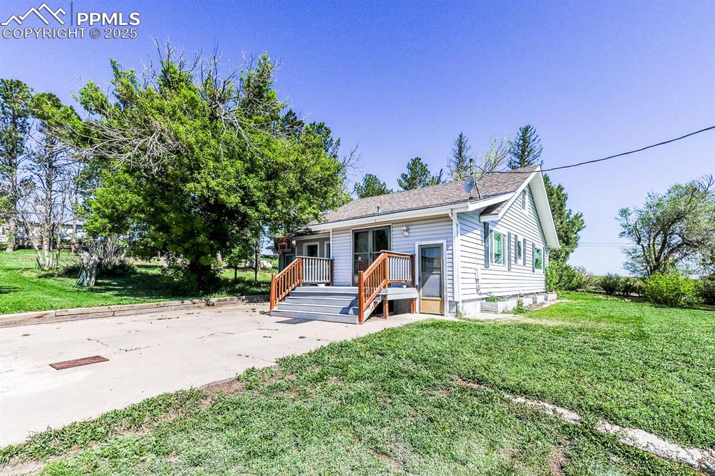 6597 Highway 83 Franktown, CO 80116 - Photo 3 of 48 a view of a house with backyard and sitting area