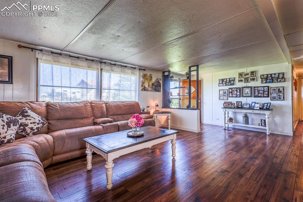 6597 Highway 83 Franktown, CO 80116 - Photo 33 of 48 a living room with furniture and a book shelf