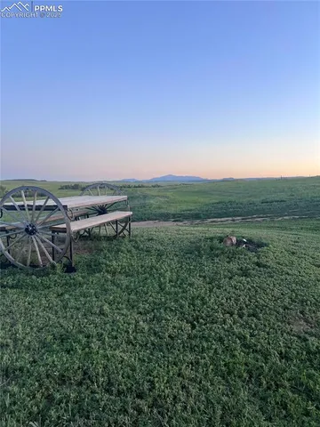 an aerial view of a houses with a yard