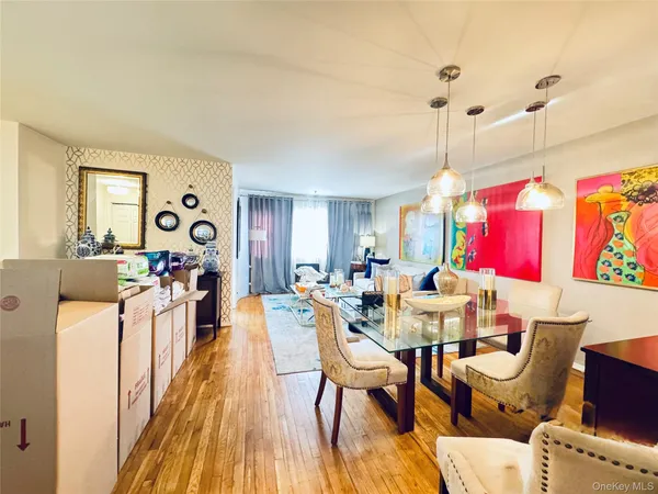 a very nice looking living room with a large window and furniture