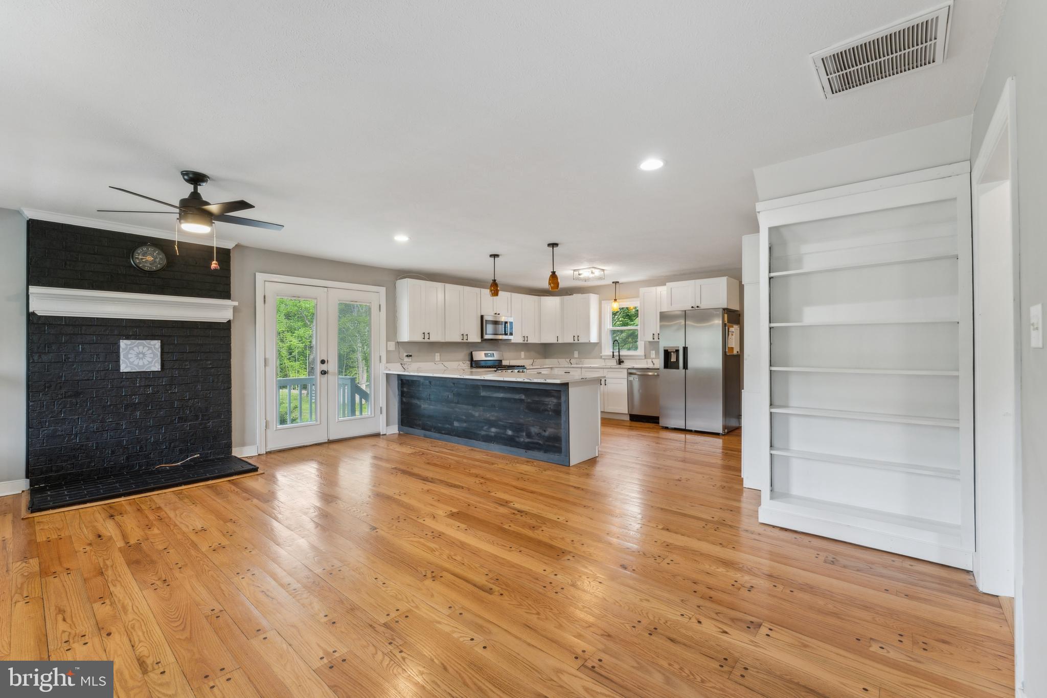 19316 Landora Bridge Road Ruther Glen, VA 22546 - Photo 2 of 35 a view of a kitchen with a sink and an empty room