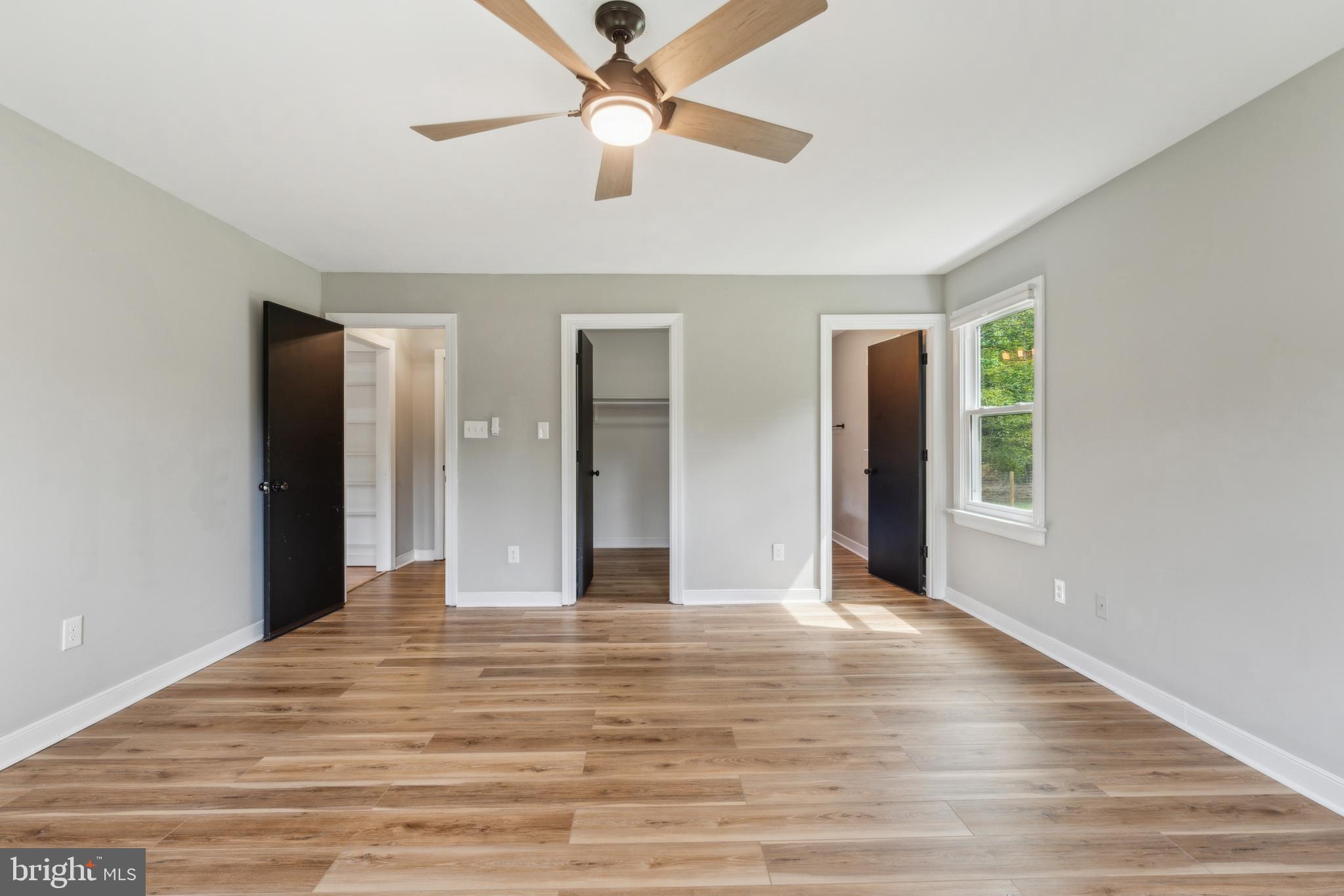 19316 Landora Bridge Road Ruther Glen, VA 22546 - Photo 4 of 35 a view of an empty room with window and kitchen view