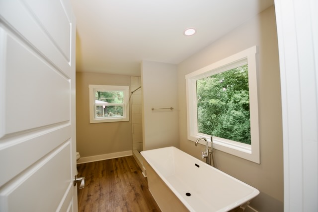 317 Pendleton Road Clemson, SC 29631 - Photo 22 of 36 Luxurious soaking tub and ample natural light define this contemporary bathroom retreat.