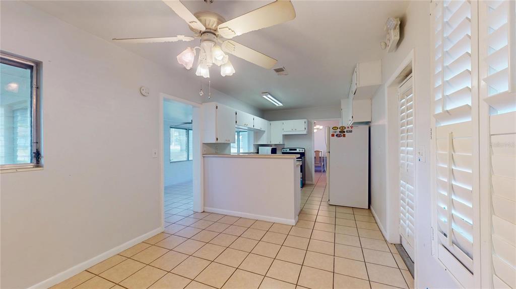 121 North Seminole Avenue Inverness, FL 34450 - Photo 11 of 47 a view of a kitchen with a sink and a refrigerator